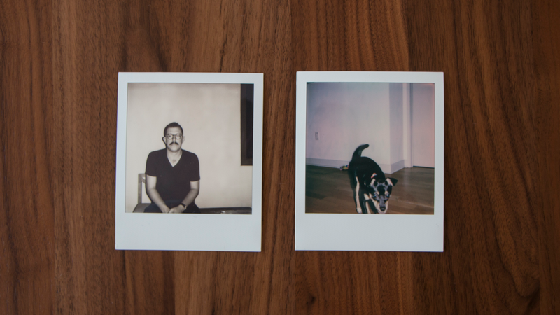 The black and white Polaroid on the left was taken in low light outside with a flash. The color Polaroid on the right was taken inside with a flash. Both look pretty bad. Photo: Adam Clark Estes/Gizmodo.